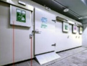 Garbage storage room with sensor-operated doors